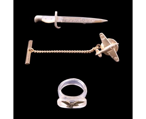 A 9 ct yellow metal RAF Spitfire tie stud, together with an RAF workshop-made Lucite and brass finger ring and a sweetheart b