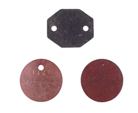 A Great War Canadian army identity disc together with a pair of Second World War fibre dog tags