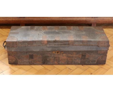 A late Georgian / early Victorian campaign or travel trunk, in hide-covered wood with brass and iron mounts, its paper-lined 