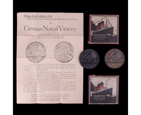 Two Lusitania medals in cartons, together with a related leaflet