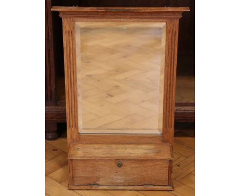 A late 19th / early 20th Century oak wall mirror cum shelf with integral small fall-front cabinet, 42 cm x 59 cm high