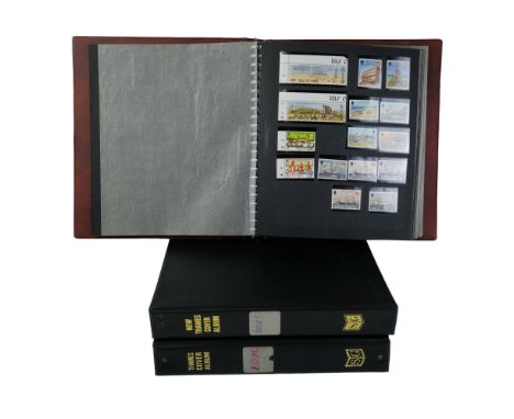 An album of QEII stamps of Isle of Man, Jersey, Northern Ireland and Wales together with two albums of first day covers of Je