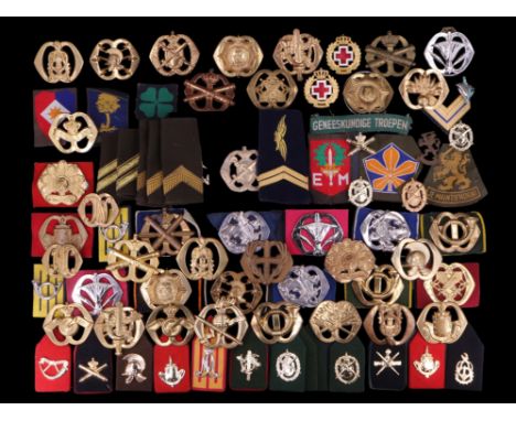 A large collection of Netherlands army and other military cap badges etc