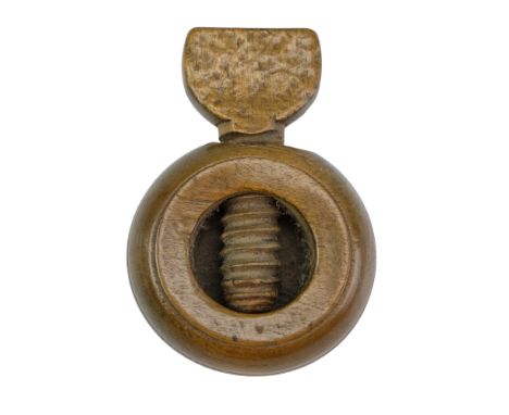 An 18th / 19th Century English treen pocket nutcracker, 4.5 cm diameter excluding carved wooden screw