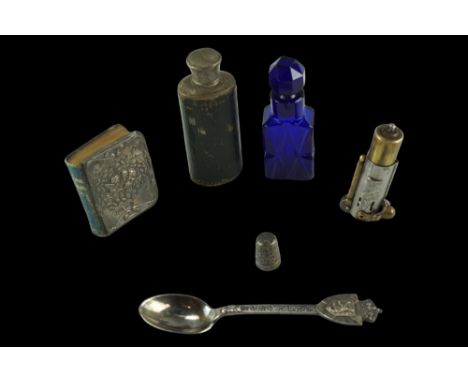 A silver thimble, a cobalt cut glass scent bottle, a small hip flask, a small silver-covered common prayer book, etc