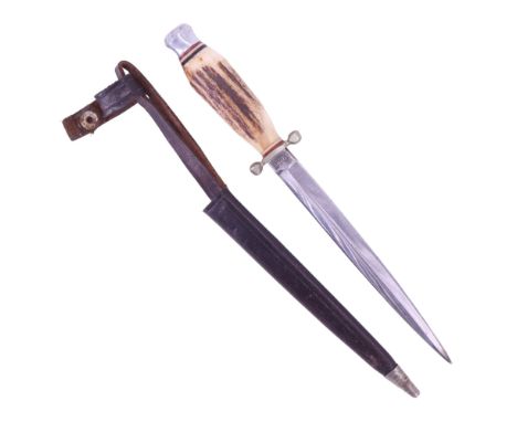 A small German stiletto, having an antler grip and leather scabbard, blade 13 cm, 21 cm overall 