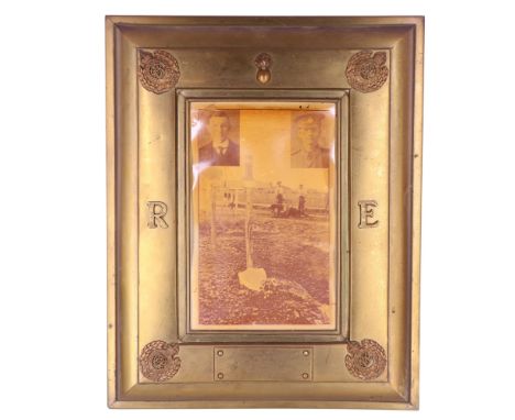 A large Great War In Memoriam photograph frame, in sheet brass faced with Royal Engineers insignia and a plague with engraved