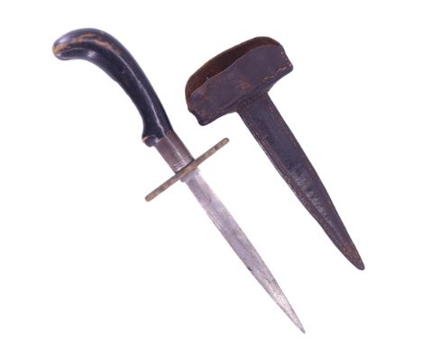 A late 19th / early 20th Century stiletto dagger, having a slender leaf-shaped blade, brass cross-guard and distinctive eboni