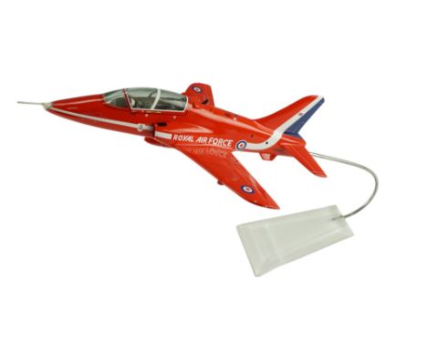 A model RAF BAE Red Arrow Hawk aircraft by Bravo Delta Models Ltd, on a stand and in original box, aircraft 29 x 23 cm