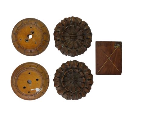 Two late 19th / early 20th Century turned and carved treen bell push patrices together with a pair of carved oak rose paterae