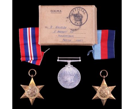 A group of Second World War campaign medals in carton awarded by the Admiralty to Mr R Whiteside of Preston