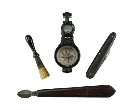 A Victorian rosewood handled ink eraser, bearing a crowned VR mark, together with a pocket folding knife, a small brush and a