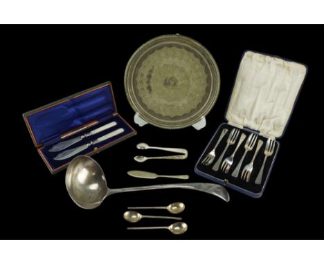 A cased pair of late 19th / early 20th Century mother-of-pearl handled electroplate butter knives together with a cased set o
