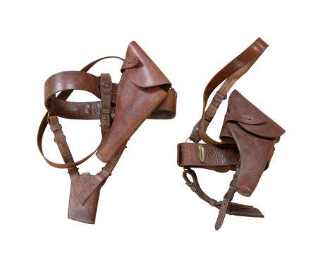 Two British army officers' Sam Browne belts with holsters and other accoutrements