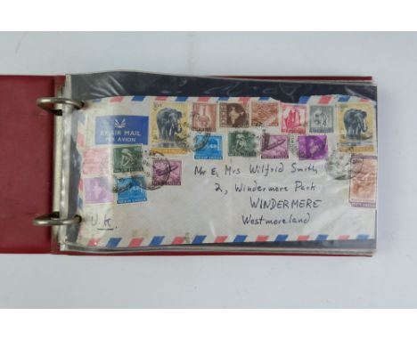 Four albums of QEII first day stamp covers together with an album of mid-to-late 20th Century world stamp covers