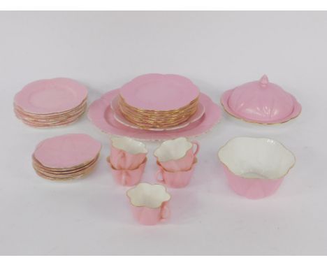 A Shelley pink ground porcelain fluted part tea service, comprising oval dish, muffin dish and cover, sugar bowl, five cups, 