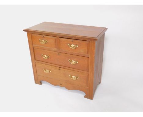 A Victorian oak chest of drawers, with two short over two long drawers, raised on fluted square legs and bracket feet.