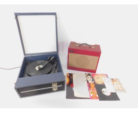 A Fidelity record player, TAKT speaker amplifier, and a small group of records.