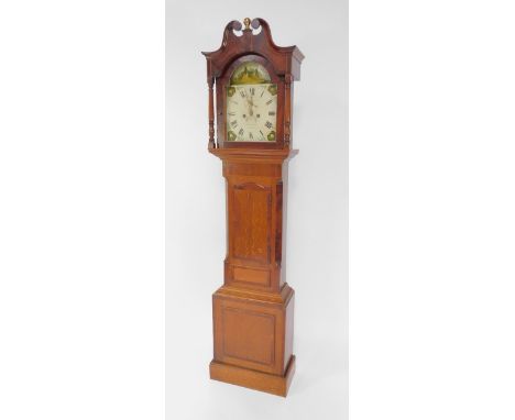 Garratt of Peterborough. A George III oak and mahogany longcase clock, the break arch dial painted with a rural landscape and