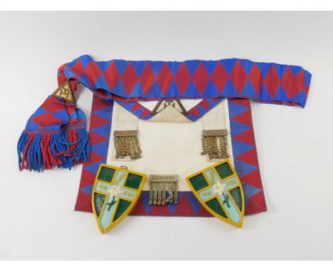 A Masonic apron and sash, Royal Arch Grand Standard Bearer, together with a pair of St Augustine ceramic shields, possibly Ma