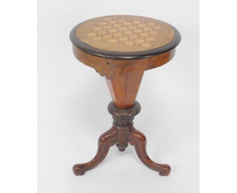 A Victorian walnut and inlaid trumpet shaped sewing and games table, the circular hinged top opening to reveal a fitted inter