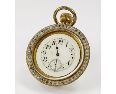 An early 20thC brass cased table clock, the circular white enamel dial with paste set surround, bearing Arabic numerals, subs