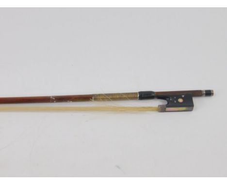 A French violin bow, with silver mounts and mother of pearl inlay.