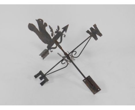 A cast iron weather vane surmounted with a squirrel, 80cm high.