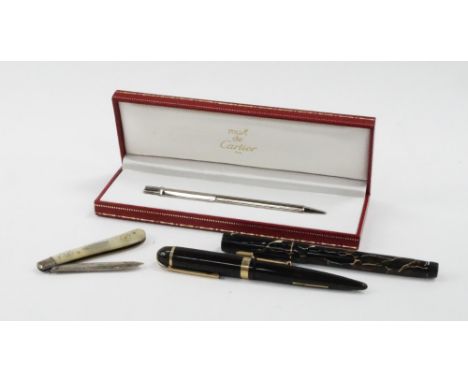 A Must de Cartier ball point pen, No.230686, boxed, an Eversharp Skyline fountain pen, with a 14ct gold nib, Maybie Todd Swan