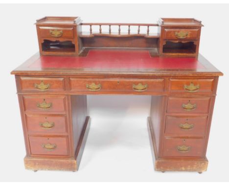 A Victorian mahogany twin pedestal desk, the top with a back super structure of two short drawers, recesses and a shaped shel