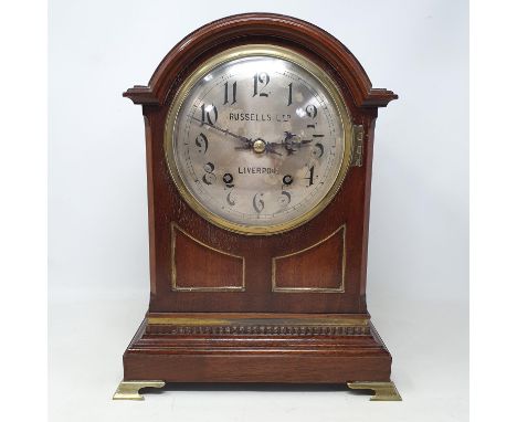 An Edwardian mantle clock, the 15 cm diameter silvered dial signed Russell Ltd Liverpool, with Arabic numerals, fitted an eig