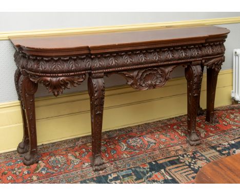 A Chippendale style breakfront mahogany serving table, with a drawer, the frieze carved acanthus leaves, on acanthus leaf car