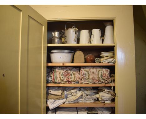 Assorted domestic enamel wares, textiles and other items (the contents of a cupboard), removal cost C 
