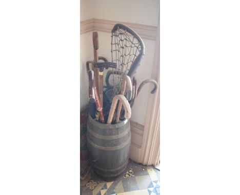 A coopered oak barrel stick stand, 56 cm high, three shooting sticks, a lacrosse stick and other sticks, removal cost A 