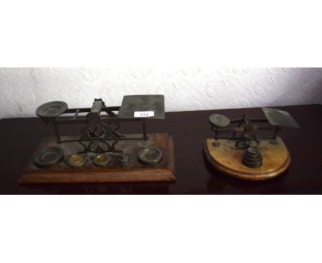 An early 20th century set of postal scales and weights and another set, removal cost A 