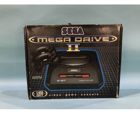 A boxed Sega Mega Drive II game console