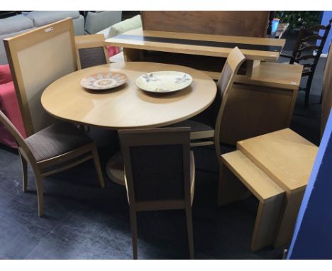 A light oak dining room suite comprising of, an extending table, sideboard, four chairs, nest of tables and over mirror