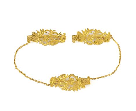 A GOLD 'FLOWER BASKET' MOTIF KEROSANG
Pierced and engraved as a basket of flowers, two of the brooches with an indistinct arr