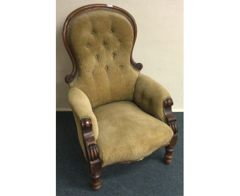 A mahogany framed button back armchair. Est. £30 - £50.