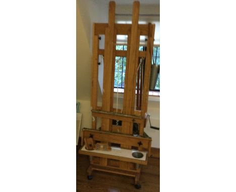 A good quality large artist easel with ratchet mechanism. Est. £200 - £300.