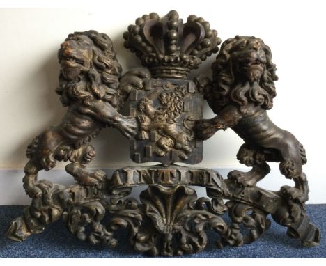 A large carved wooden coat of arms with crown finial and scroll decoration and crested centre. Est £200 - £300. 