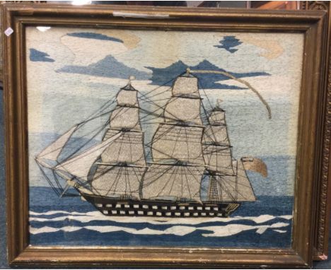 A good framed and glazed tapestry of a boat under sail. Est. £50 - £80.