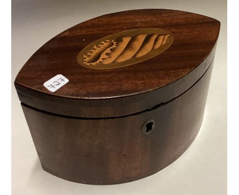 An oval mahogany Georgian tea caddy with shell inlay. Est. £100 - £150.