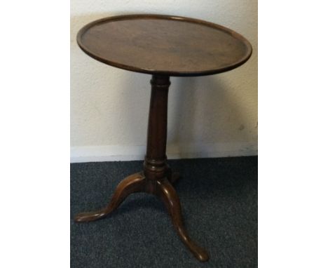 A Georgian tripod table on four sweeping supports. Est. £50 - £80.