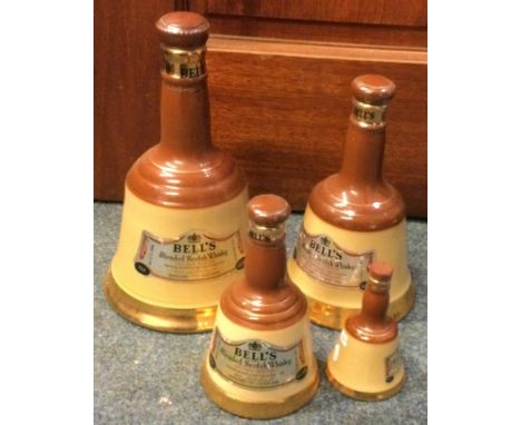 A set of four graduating sized bell shaped bottles of Bell's Blended Scotch Whisky. Est. £20 - £30.