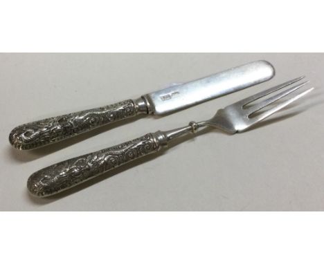 A mid 19th Century Chinese export silver christening knife and fork. Marked. Approx. 40 grams. Est. £80 - £120.