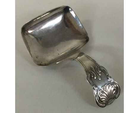 A George III silver caddy spoon with vine pattern. London 1806. Approx. 11 grams. Est. £50 - £80.