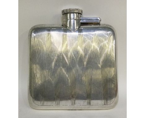 A heavy engine turned silver hip flask with hinged top. Birmingham. Approx. 170 grams. Est. £60 - £80.