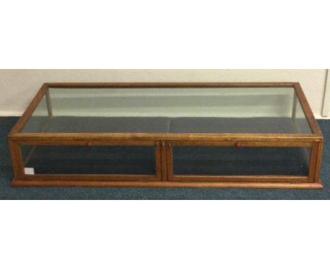 A small glass jewellers display cabinet. Est. £30 - £50.