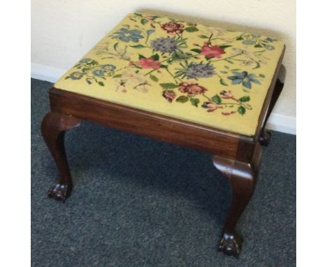 A large Chippendale style stool with tapestry inset. Est. £20 - £30.